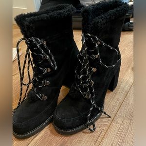 STUART WEITZMAN black fur heeled lace up combat boots